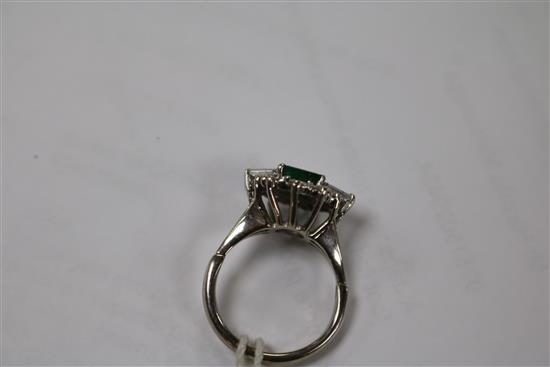 A white metal, emerald and diamond cluster dress ring, size M.